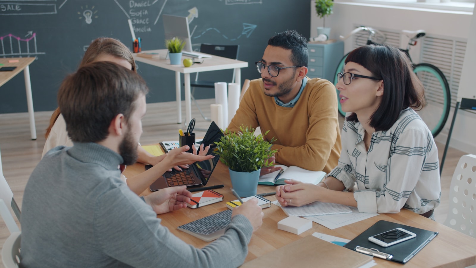 Diverse team celebrating together during an office meeting